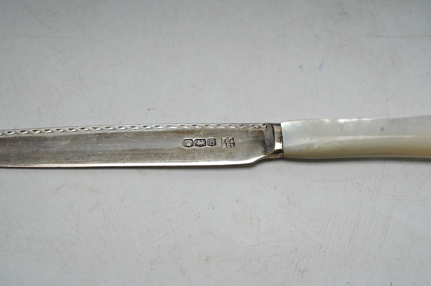 Six pairs of George V mother of pearl handled silver dessert eaters, Frederick C. Asman & Co, Sheffield, 1925, knife 18.9cm. Condition - fair to good